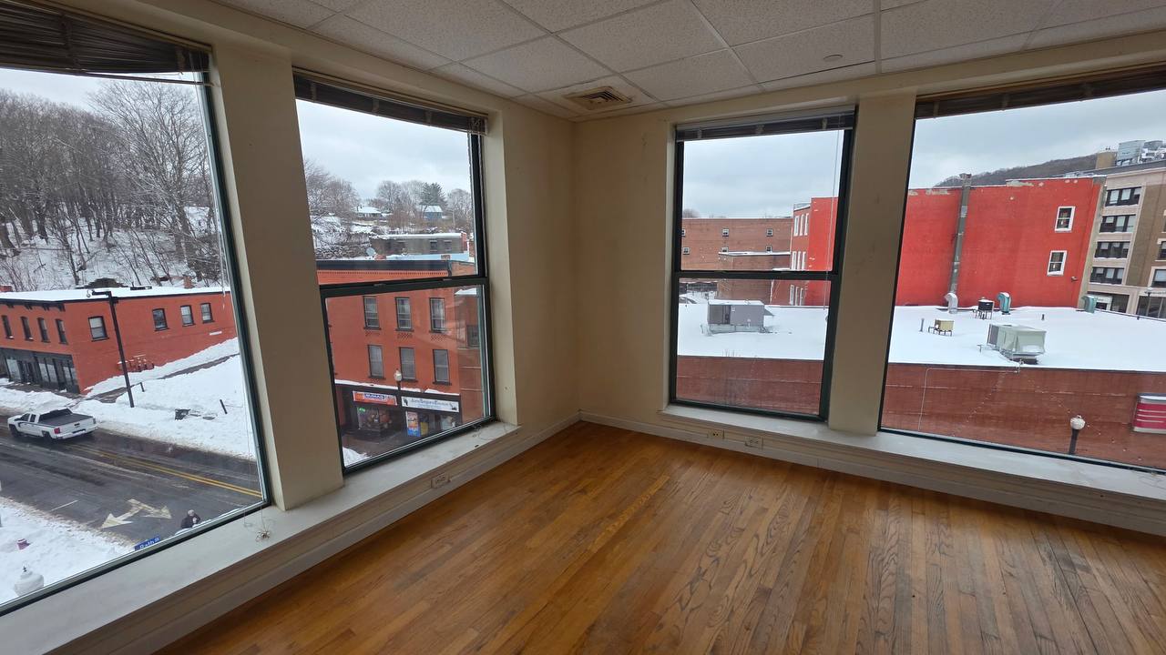 Corner apartment with hardwood floors and large windows overlooking downtown Norwich