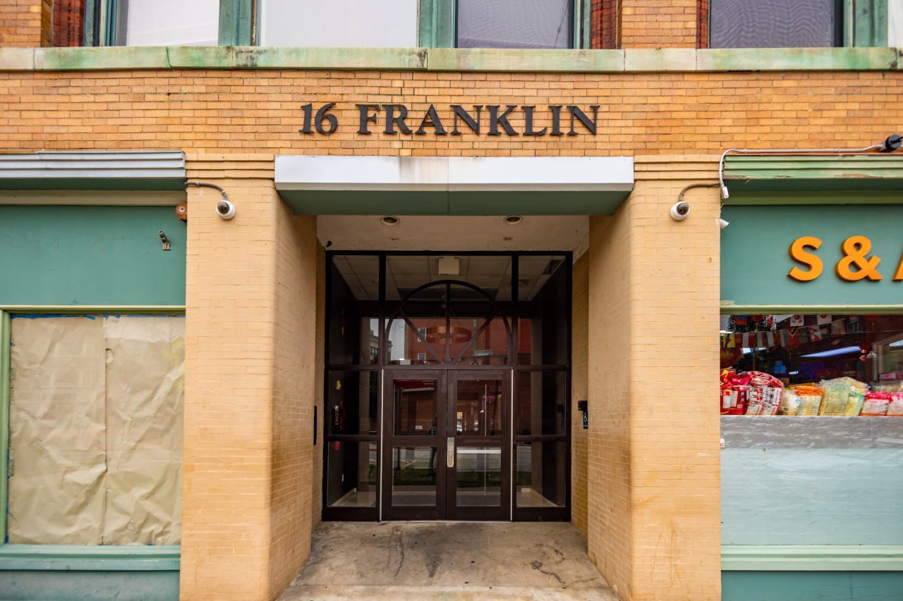 Secure main entrance at 16 Franklin with smart intercom and cameras