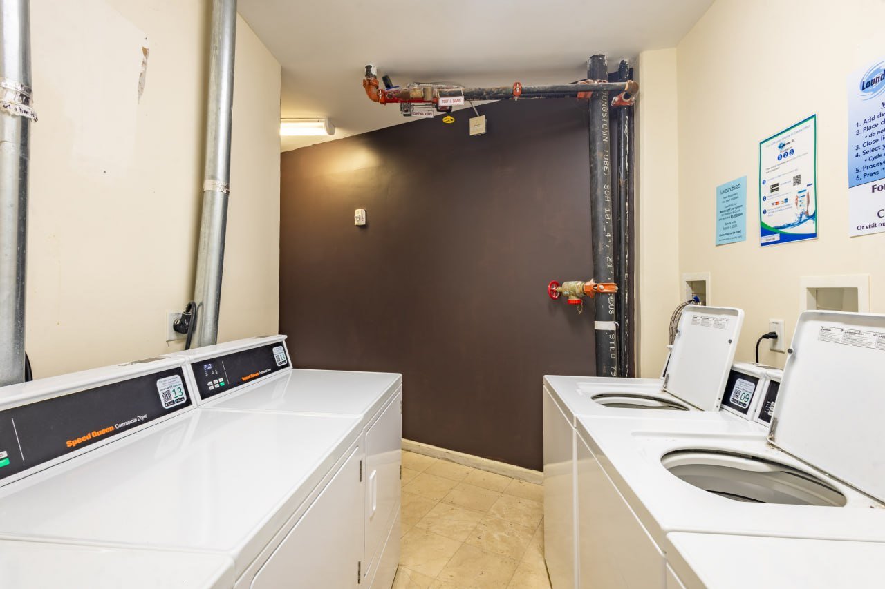 On-site laundry room with Speed Queen commercial washers and dryers